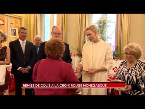 Parcels handed out at Monaco Red Cross by T.S.H. Prince Albert II and Princess Charlene