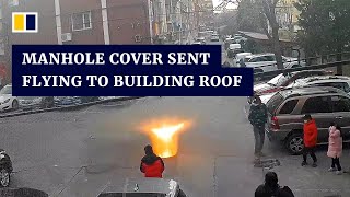 Manhole cover sent flying to building roof after boy sets off firecracker