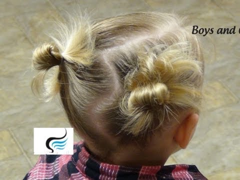 Little girl with playful messy buns hairstyle and pigtails, showcasing a cute and easy hairstyle tutorial for kids by Boys and Girls Hairstyles.