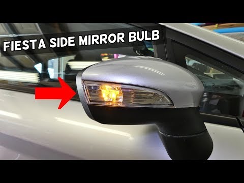 Part of a video titled HOW TO REPLACE REMOVE SIDE MIRROR TURN SIGNAL LIGHT ...