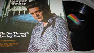 I'm Not Through Loving You Yet by Conway Twitty from 1974.
