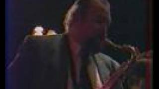 Sixteen men swinging.