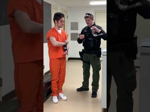 Handcuff with black box and belly chains