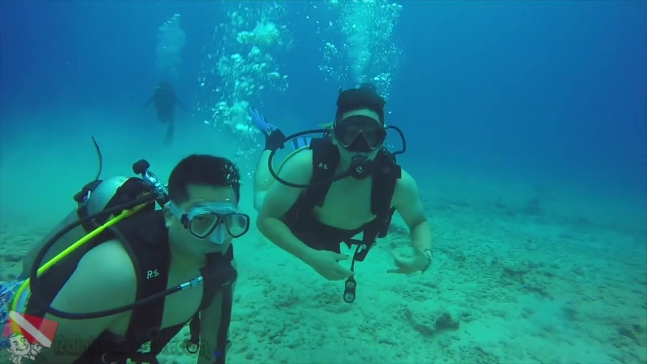 Divers make a giant-stride entry off Honolulu, Oahu