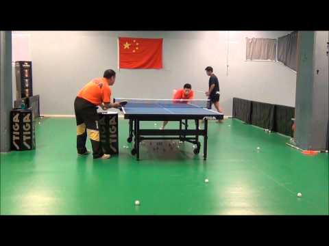 Ma Long doing multiball with head coach Liu Guoliang