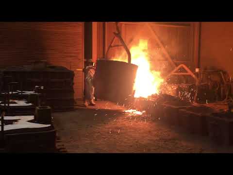 Pouring molten metal into castings at Pacific Steel Casting