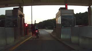 Motorcycle rider has tough time at toll booth
