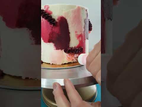 Applying piping to cake