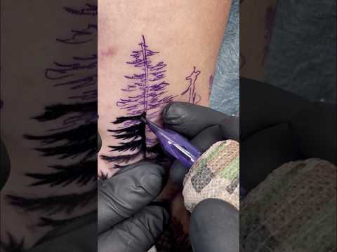 Forest around the hand tattoo