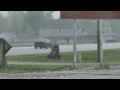 Video 'Guy Mowing Grass During Hail Storm'