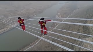 Workers Maintain World&#39;s Highest-voltage Power Line across Yellow River