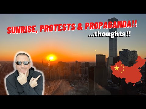 Watching the sun rise in China to reflect over the Beijing protest!!