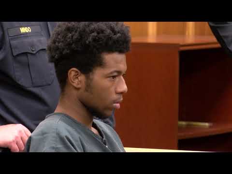 Quaimere Mohammed listens to texts messages in court