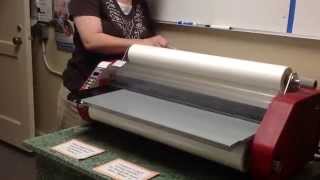Video tutorial on how to load a laminator.