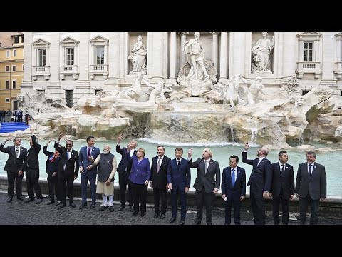 Leaders of the G20 throw coins inside the Trevi Fountain