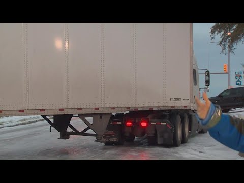 DFW ice storm: 18-wheeler stuck on slick incline in Fort Worth, Texas