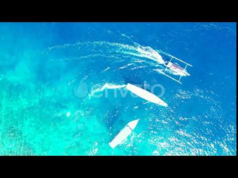 Wide drone clean view of a white sandy paradise beach and aqua blue ocean background in colourfu...