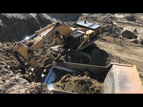 Caterpillar 385C Excavator Loading Caterpillar Dumpers