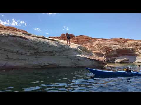 Rock jumping during kayak tour. 