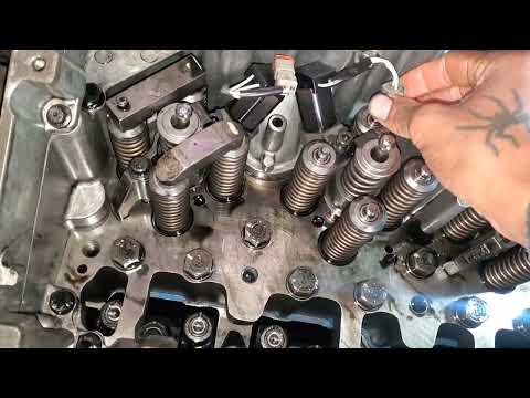 Inside a cummins m11 engine installing injectors