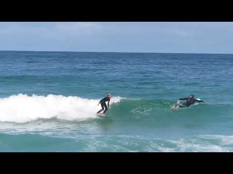 Joonas surfing in Portugal w Dad and Milena