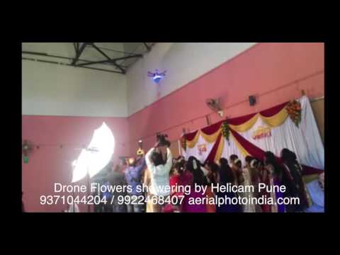Flower shower by drone and engagement ring delivery by drone at a Pune wedding