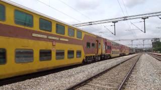 preview picture of video 'Chennai Bangalore Double Decker Express cruising past Tyakal at top speed'