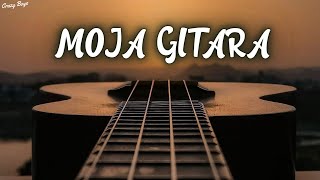 Kadr z teledysku Moja gitara (cover Gitara) tekst piosenki Arek Kopaczewski & Loki