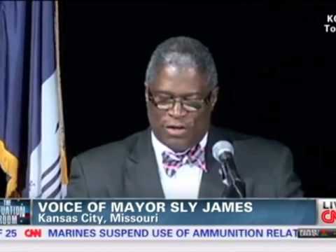 Man Rushes Stage, Throws Flag, Cusses, Tackles, Mayor Sly