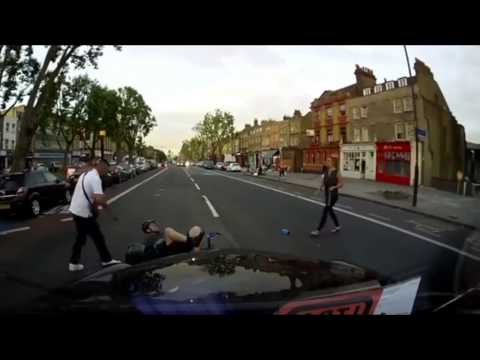 Cyclist swerves avoids a car door opened in front of him and is hit by a passing taxi