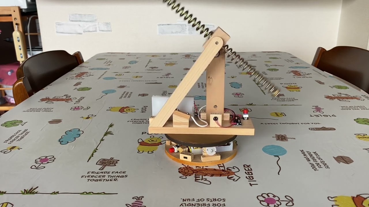 A ball falling through the coil.