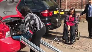 How to get an electric folding wheelchair into a car using ramps ( customer demo)