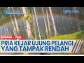Pria Kejar Ujung Pelangi Yang Tampak Rendah