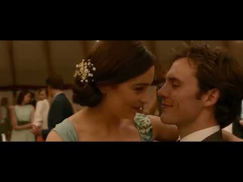 Lou and Will dancing together in an evening reception scene from the trailer