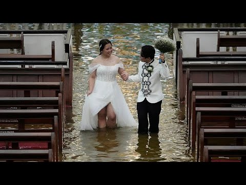 Taifun kann Hochzeit in überfluteter Kirche auf den Philippinen nicht stoppen