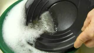 Removing magnetite from black sands, panning down to only gold.  3/3