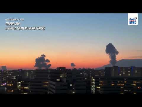 Explosions and thick smoke rise above Tehran's evening skyline