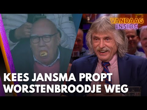 Johan lacht om beelden van Kees Jansma die opzichtig een worstenbroodje naar binnen propt