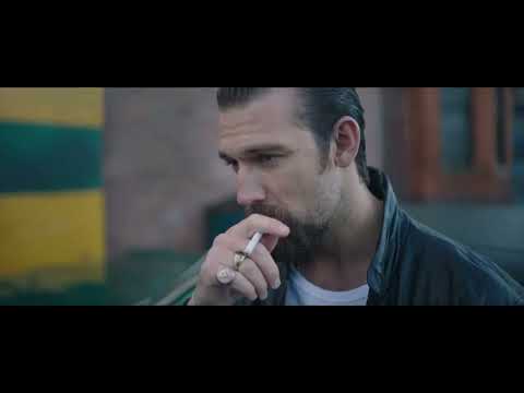 5lbs of Pressure trailer frame: Luke Evans walking a bleak city block at dusk