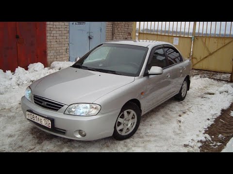 Где находится расширительный бачок на Киа Спектра?