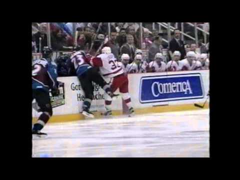 Kris Draper hits Hejduk into the Avs bench 5/11/99
