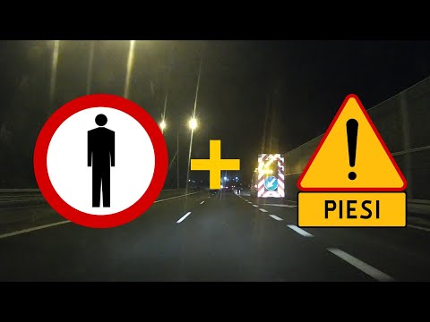 Piesi na drodze, gdzie jest zakazany ruch pieszych? Nie, to tylko oznakowanie robót drogowych.