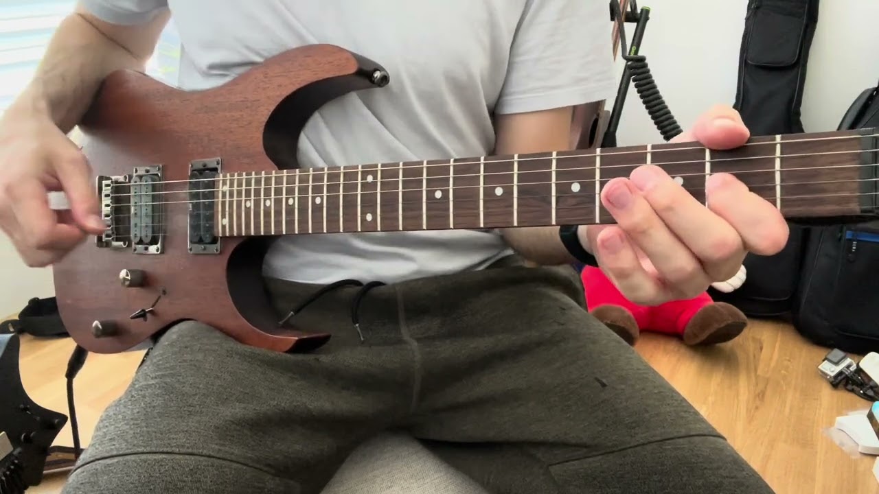 Roberto Barlocci playing a distorted metal cover of I Love Rock 'n' Roll on electric guitar