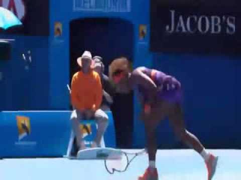 Serena Williams smashes her tennis racket