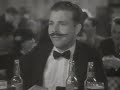 Twenty Million Sweethearts (1934) -- The singing waiter sings "The Man on the Flying Trapeze"