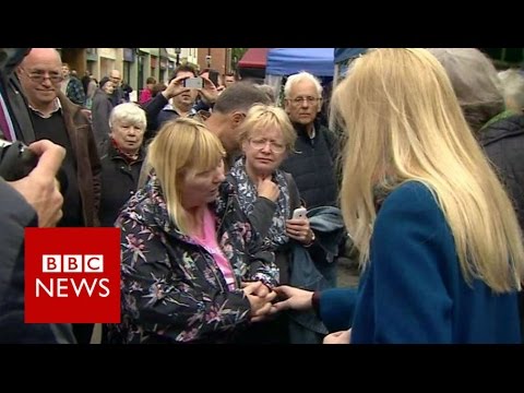 Woman tells Theresa May: I'm angry because I've no carer - BBC News