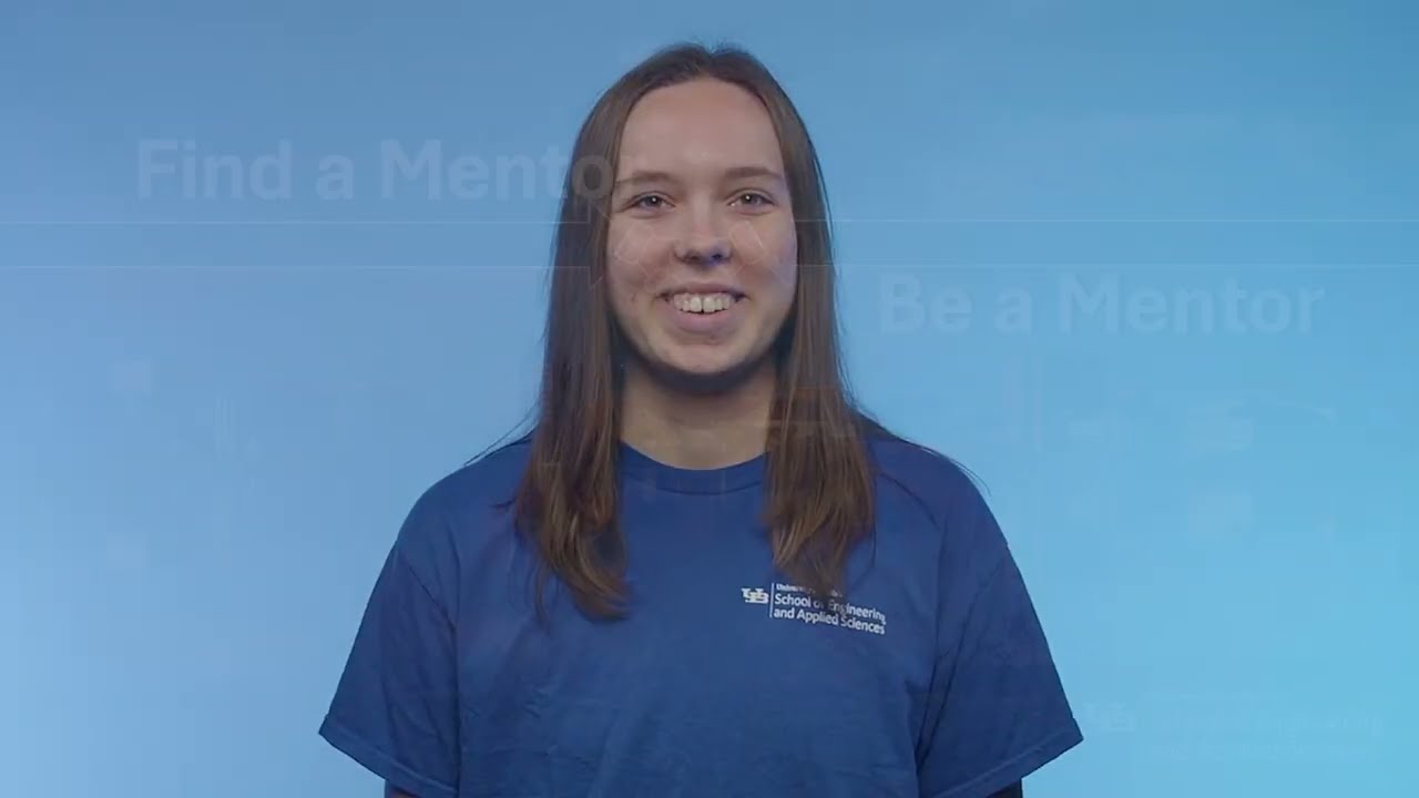 Various students discussing importance of mentorship to camera in front of blue background.