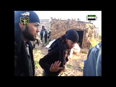 تجمع مقاتلي لواء تبارك الرحمن قبيل اقتحام تل الجابية في ريف درعا