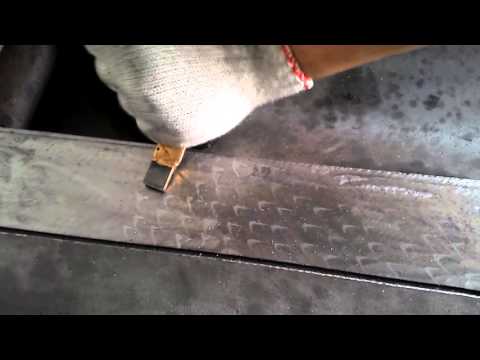 FEDA worker is chipping on parts of FEDA thread rolling machine