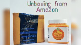 Unboxing cheese powder from Amazon.